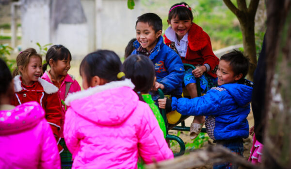 Children playing in winter coats